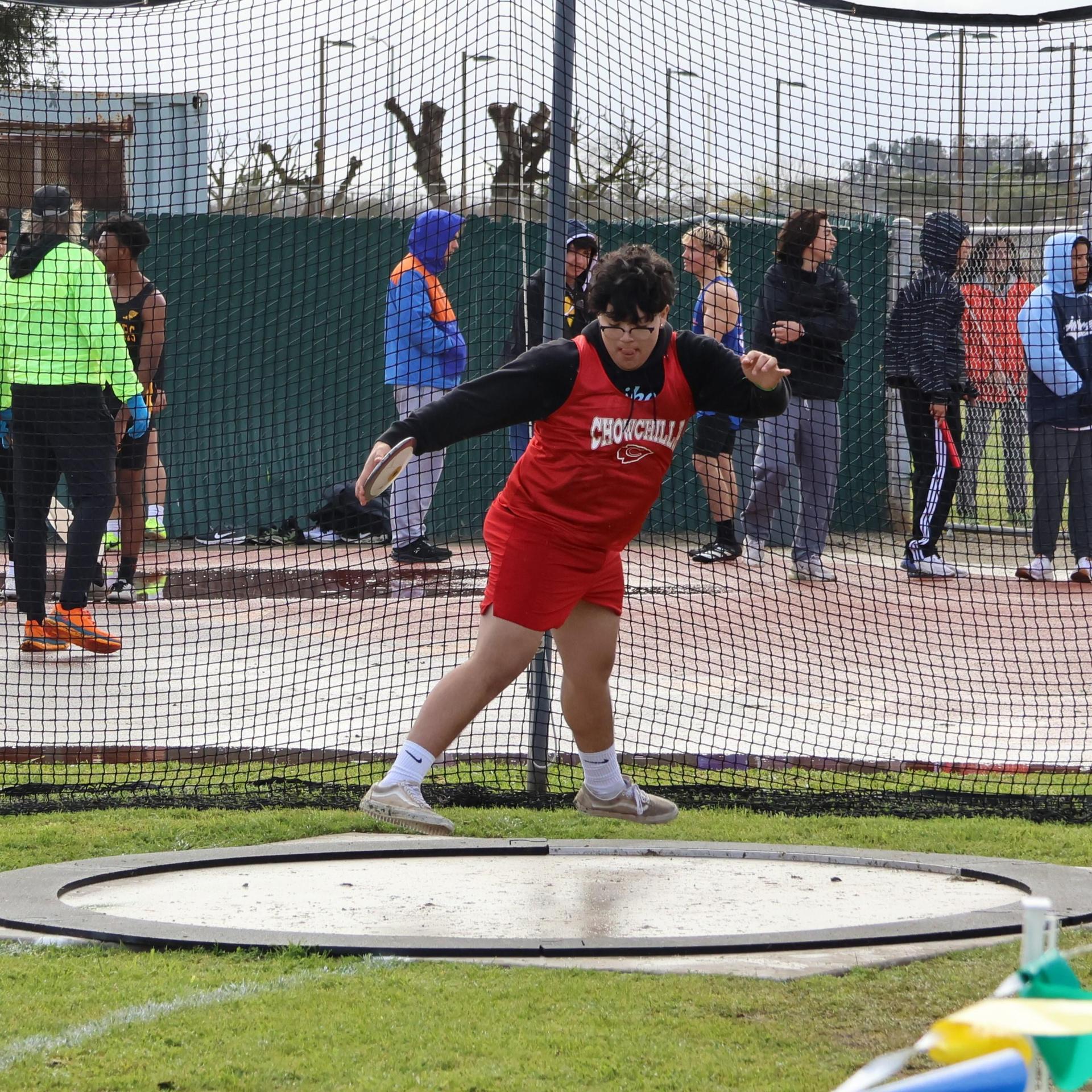 junior varsity boys throwing the discus