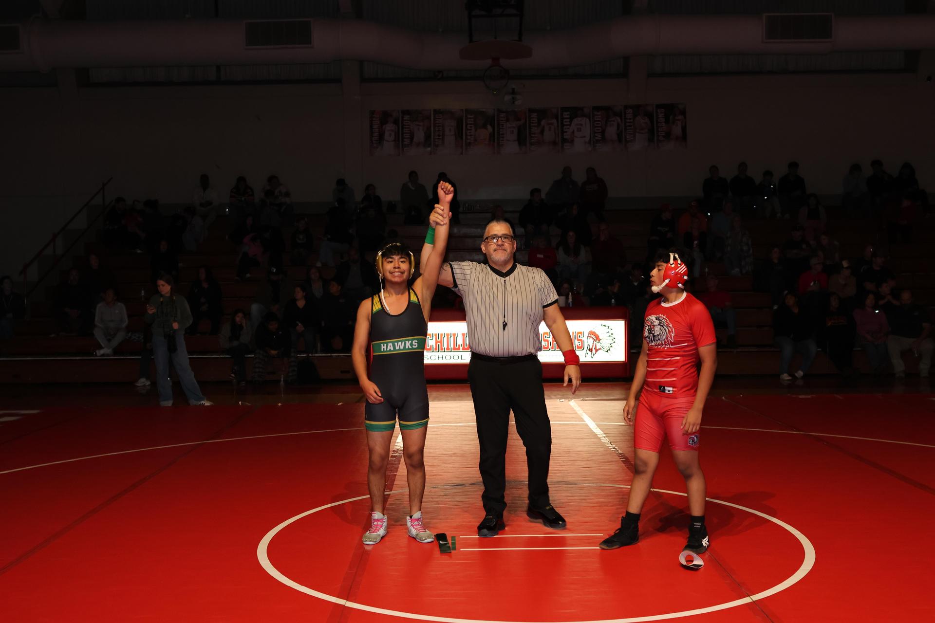 Wrestling winners with hands up 85