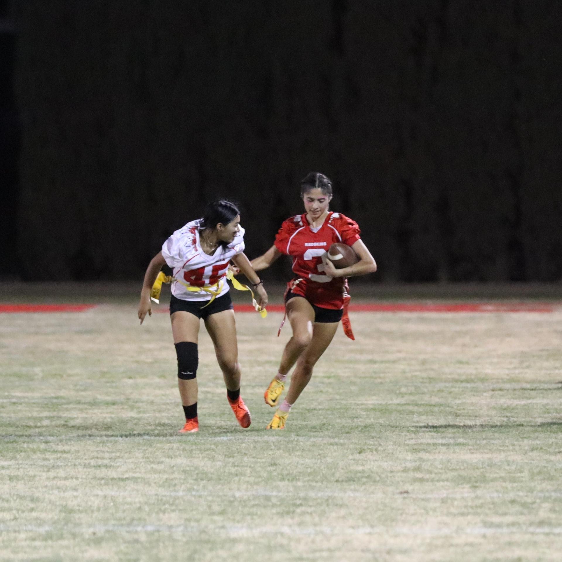 girls playing flag football