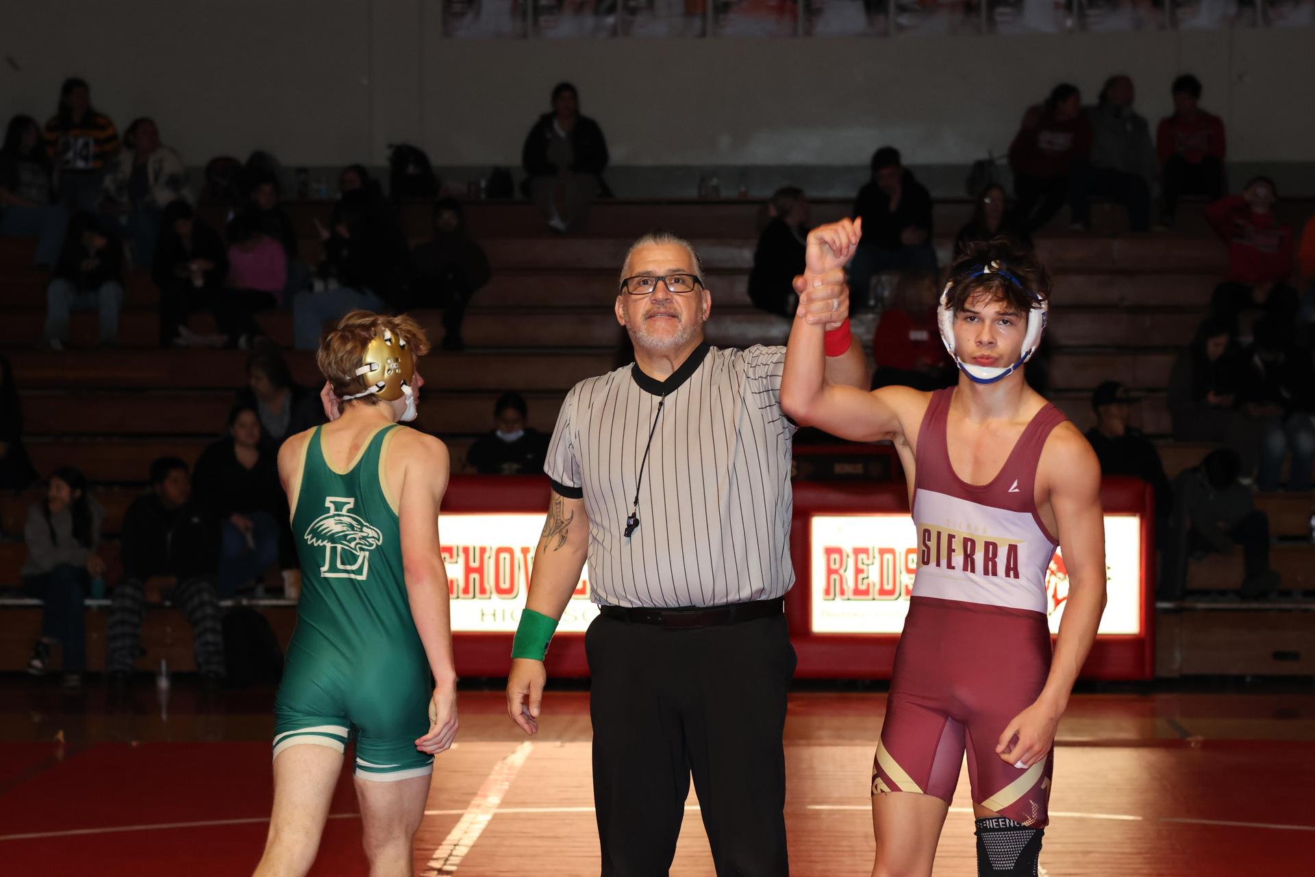 Wrestling winners with hands up 62