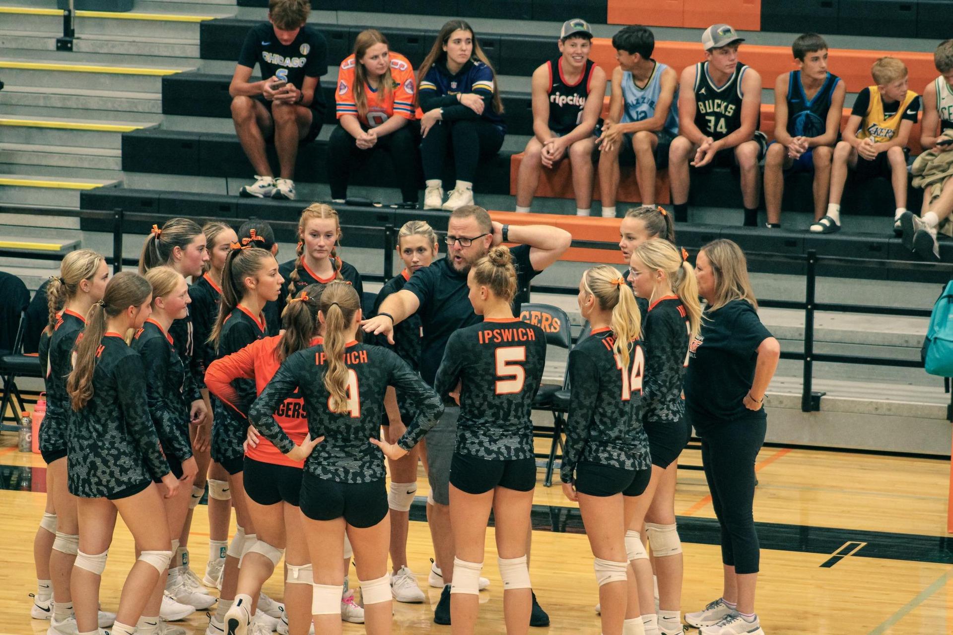 VB Girls in team huddle