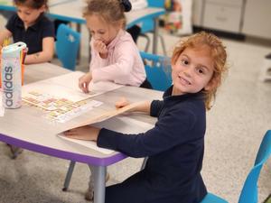 a student changes a word on her word board