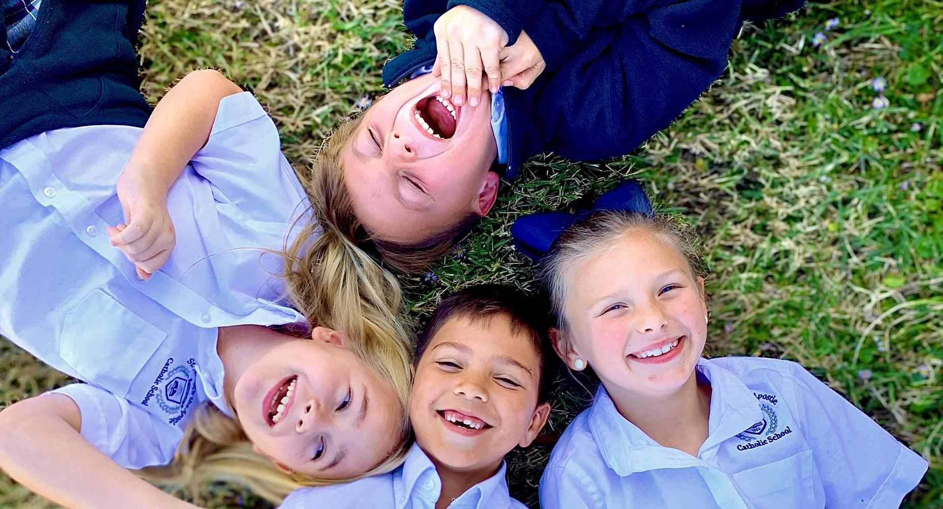 Kids Laying in Grass
