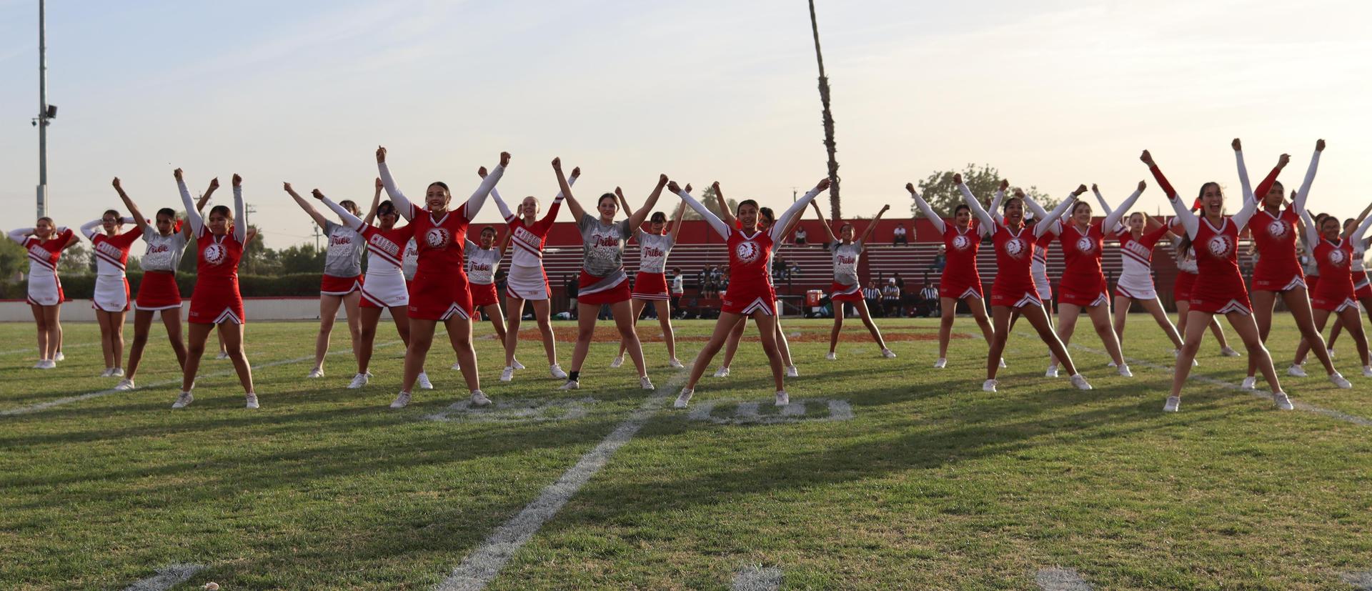 Cheerleaders performing at the football game