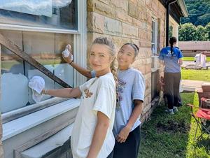Team cleaning windows