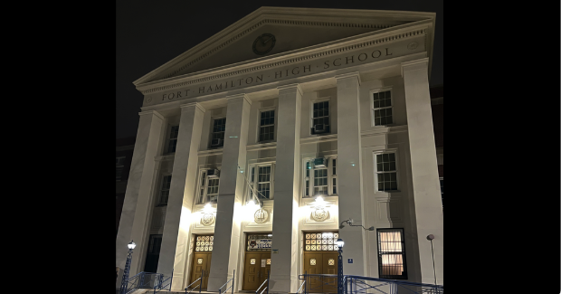 THE MAIN ENTRANCE OF FORT HAMILTON HIGH SCHOOL AT NIGHT
