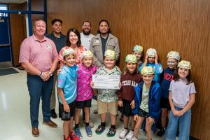 Staff and Students celebrate during Prize Patrol