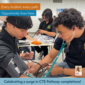 High school students conducting blood pressure checks in a CTE classroom with text overlays that read,  Celebrating a surge in CTE Pathway completions! Every student, every path. Opportunity lives here.