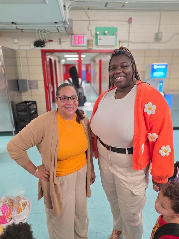 Staff members wearing orange