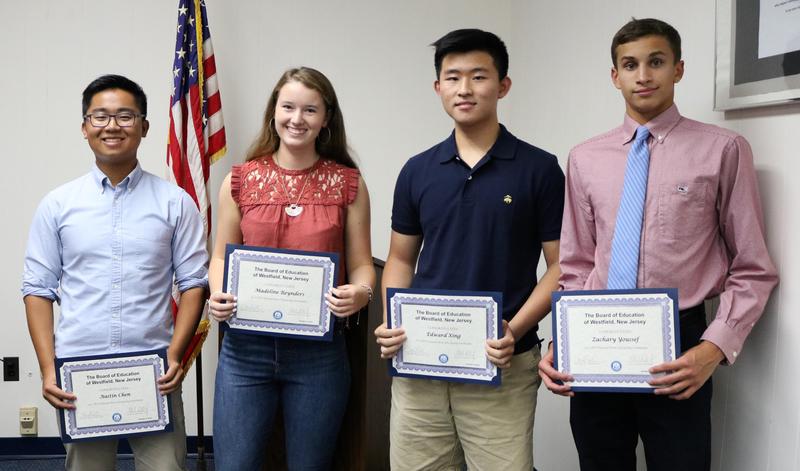 Westfield High School seniors Austin Chen, Madeline Reynders, Edward Xing, and Zachary Youssef receive congratulatory certificates at the Oct 9 Board of Education meeting as semifinalists in the 2019 National Merit Scholarship Program.