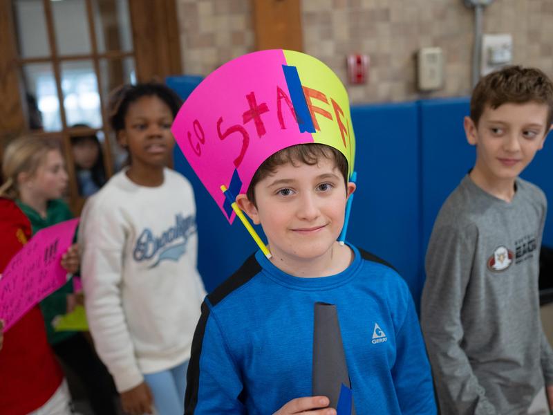 Students cheer for fellow students and/or the staff during our annual Catholic Schools Week.