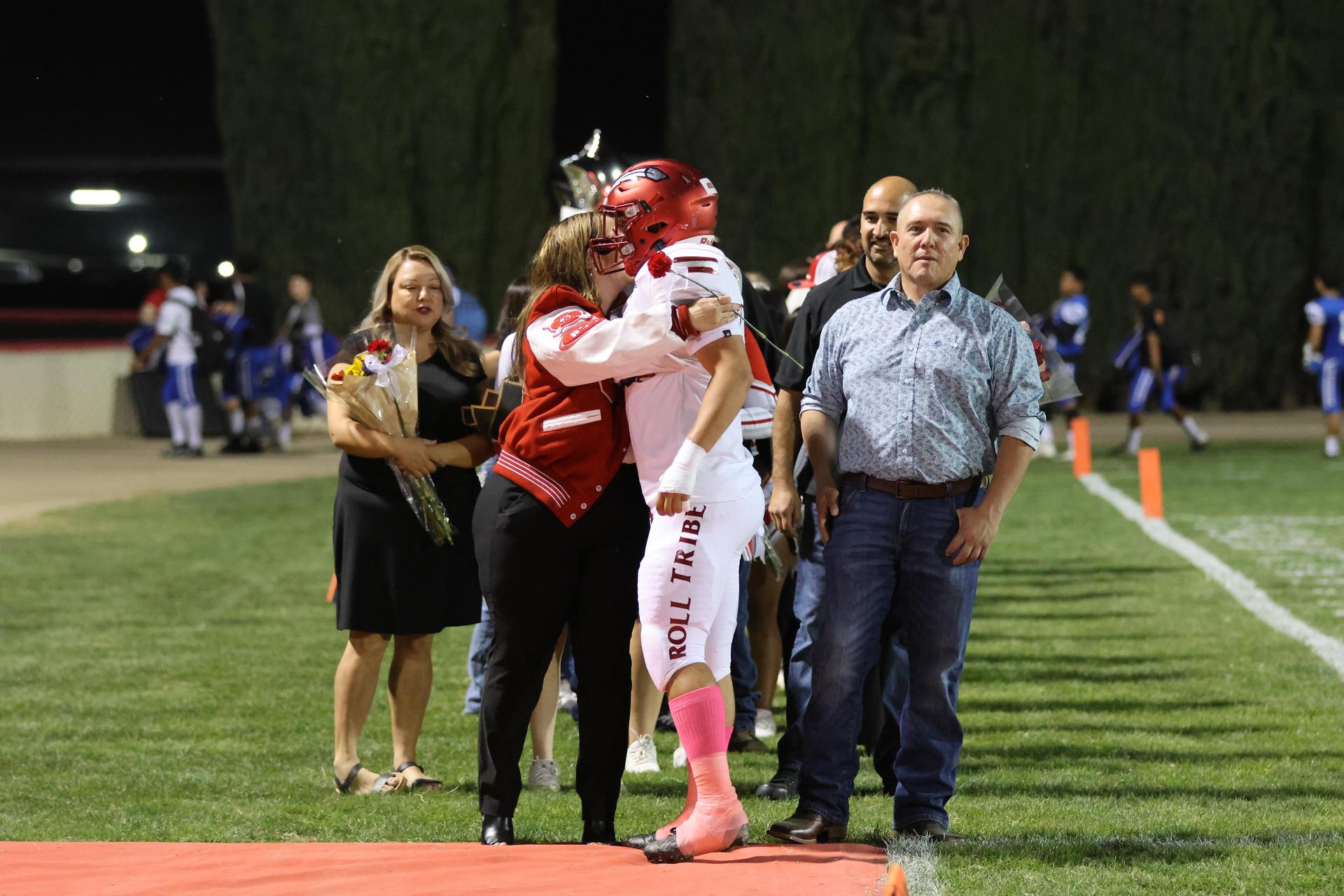 seniors and their escorts celebrating senior night