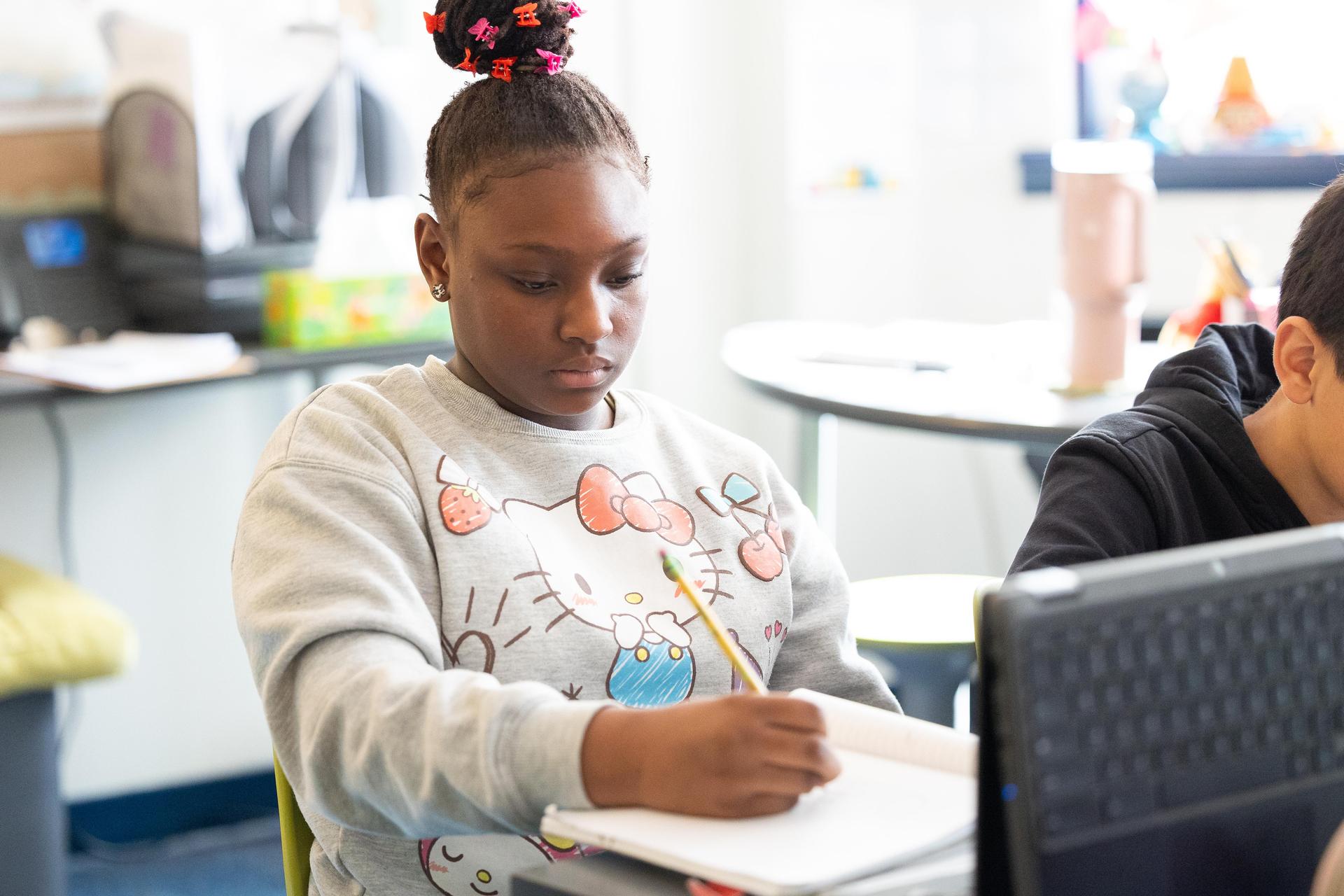 A student working on an assignment in class