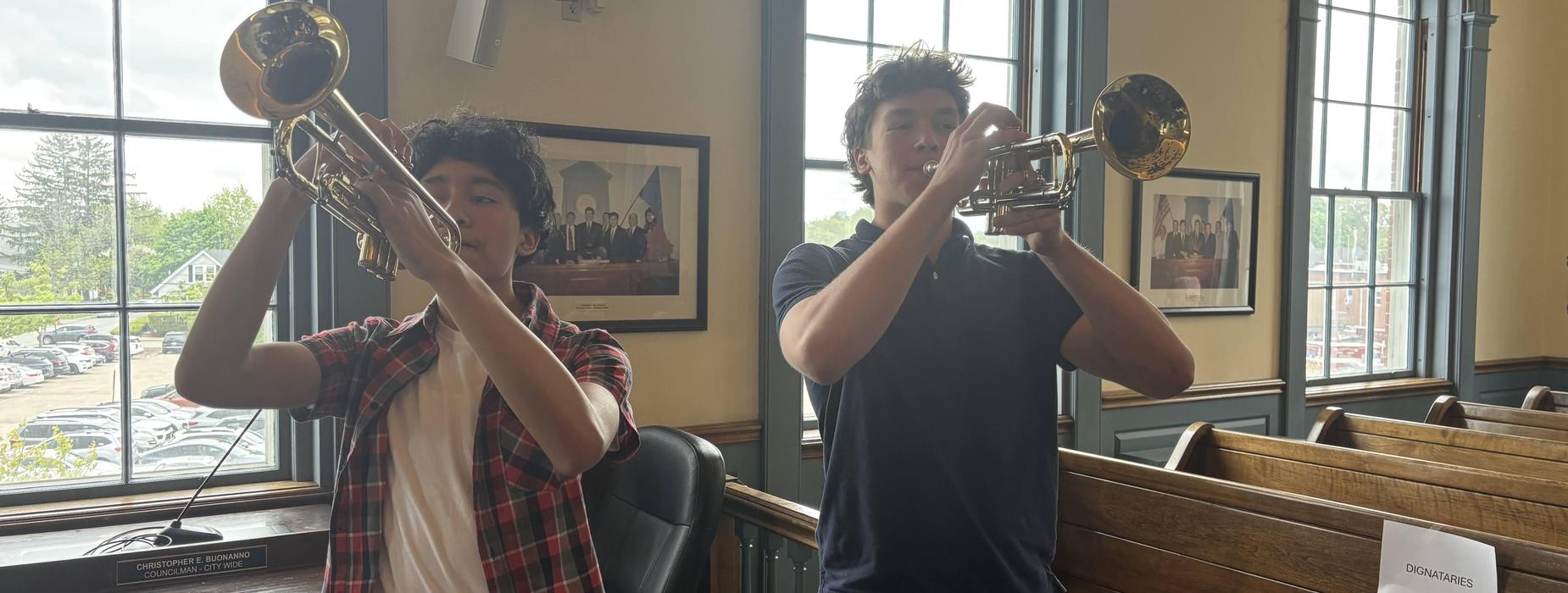 Students playing the trumpet at City Hall