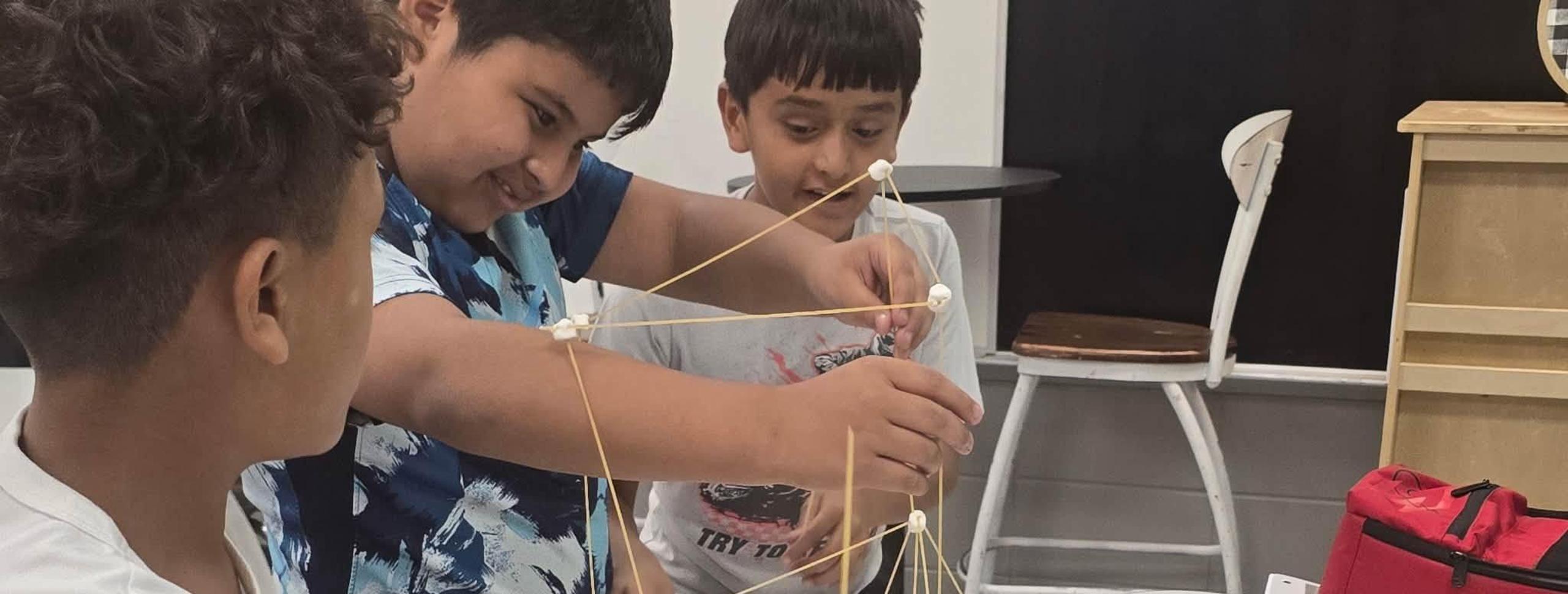 kids connecting noodles