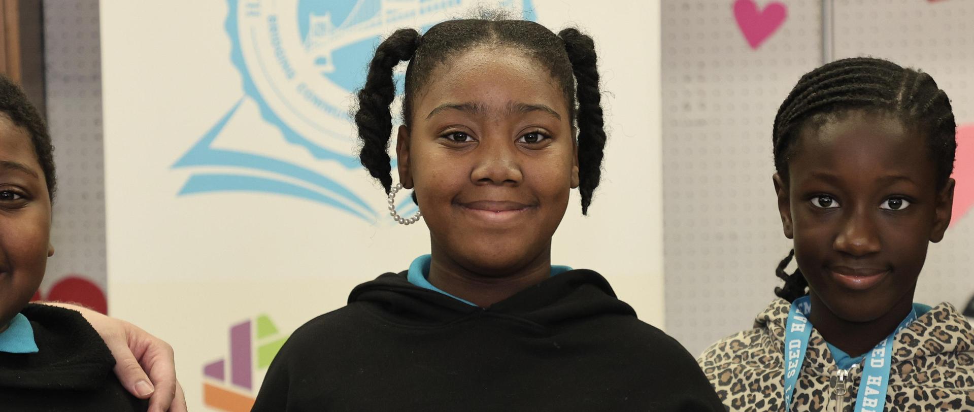 Student smiling with presentation