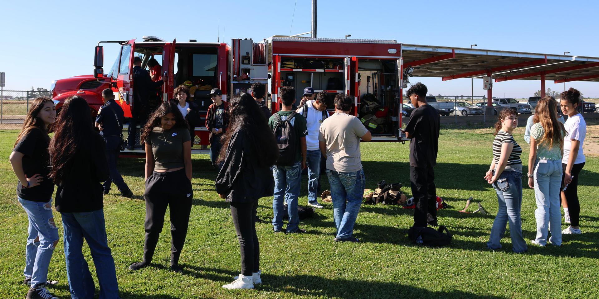 Firefighters speaking to students