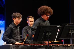 The percussion ensemble plays a piece