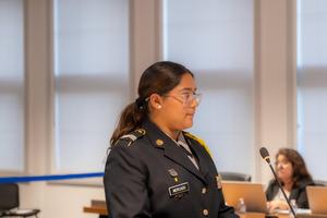 one cadet at the school board meeting podium