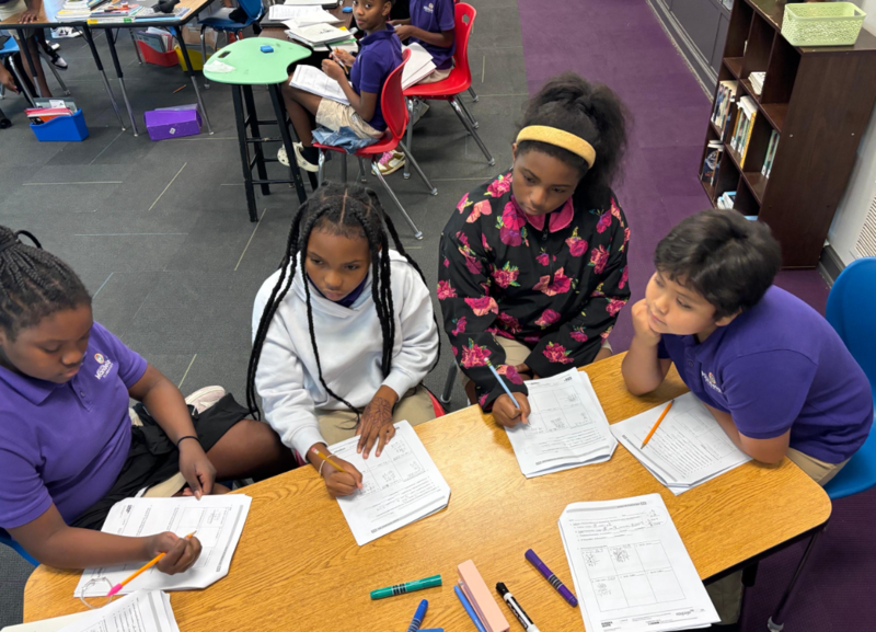 Scholars working on math worksheets