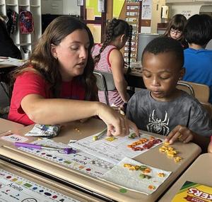 For Erskine Elementary's Strati, teaching reading skills is a personal passion
