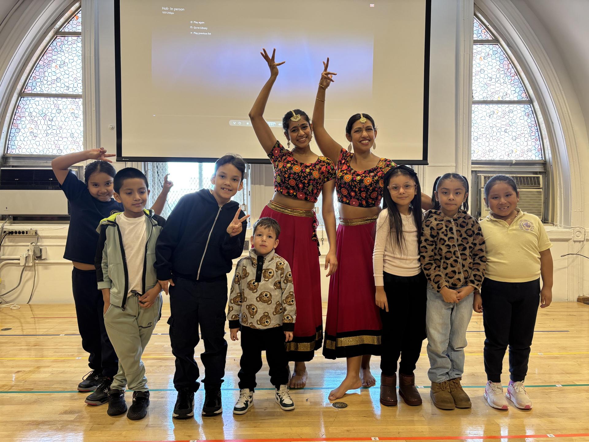 students posing with professional bollywood dancers