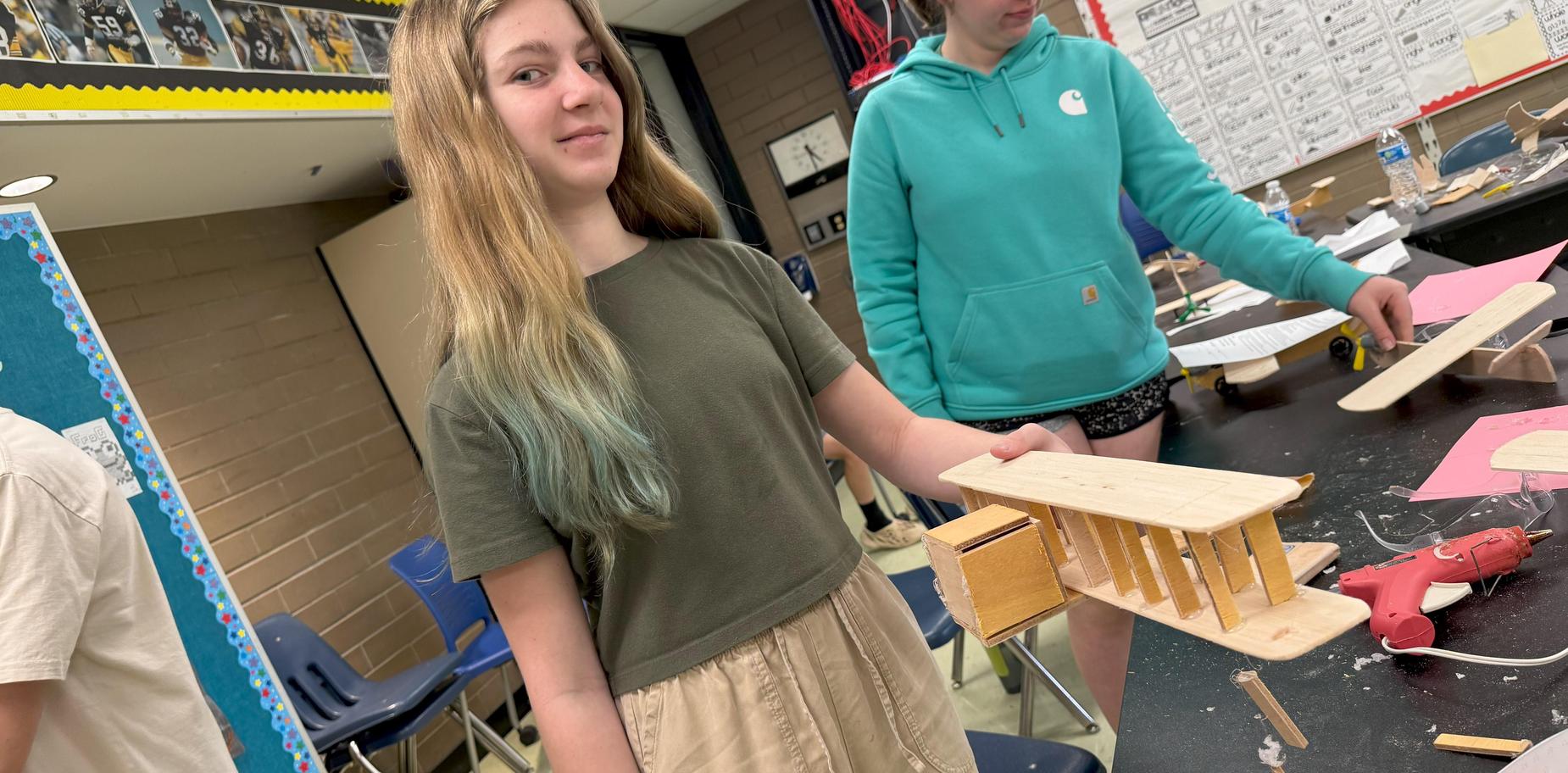 a girl with a wooden glider
