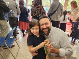A student poses with her parsha.
