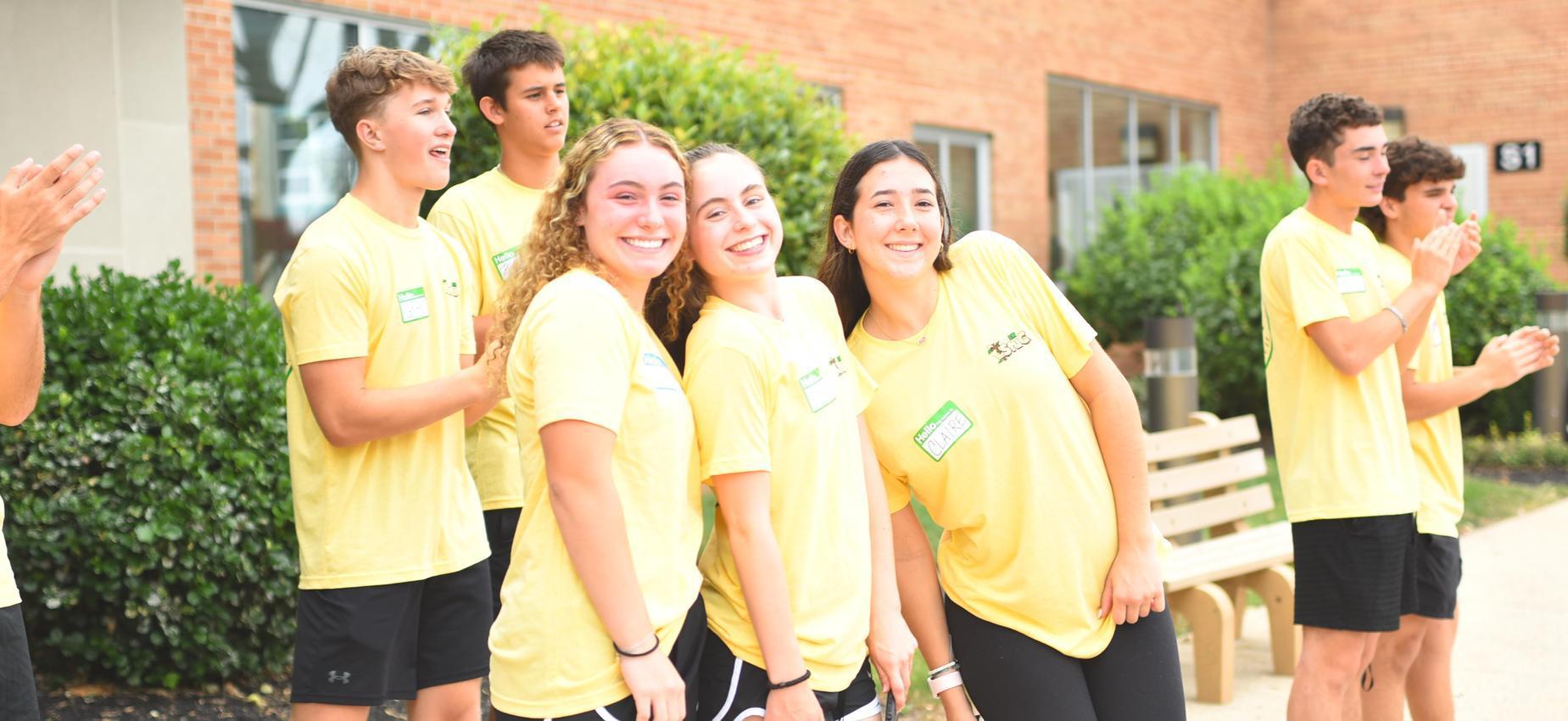 group of people in yellow shirts