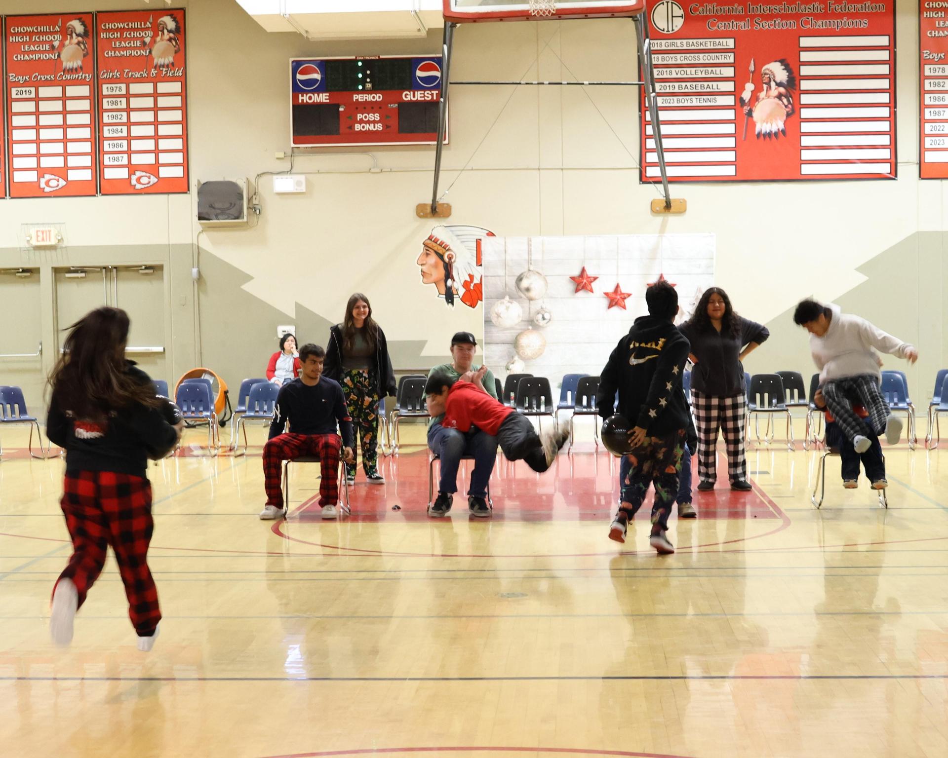 students playing the balloon pop game