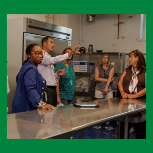 People touring kitchen