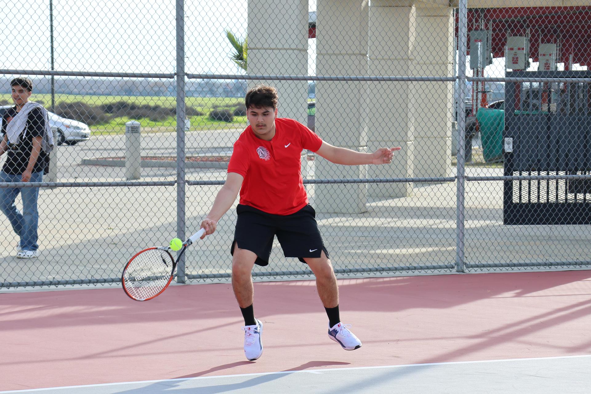 CUHS Boys playing tennis against coalinga