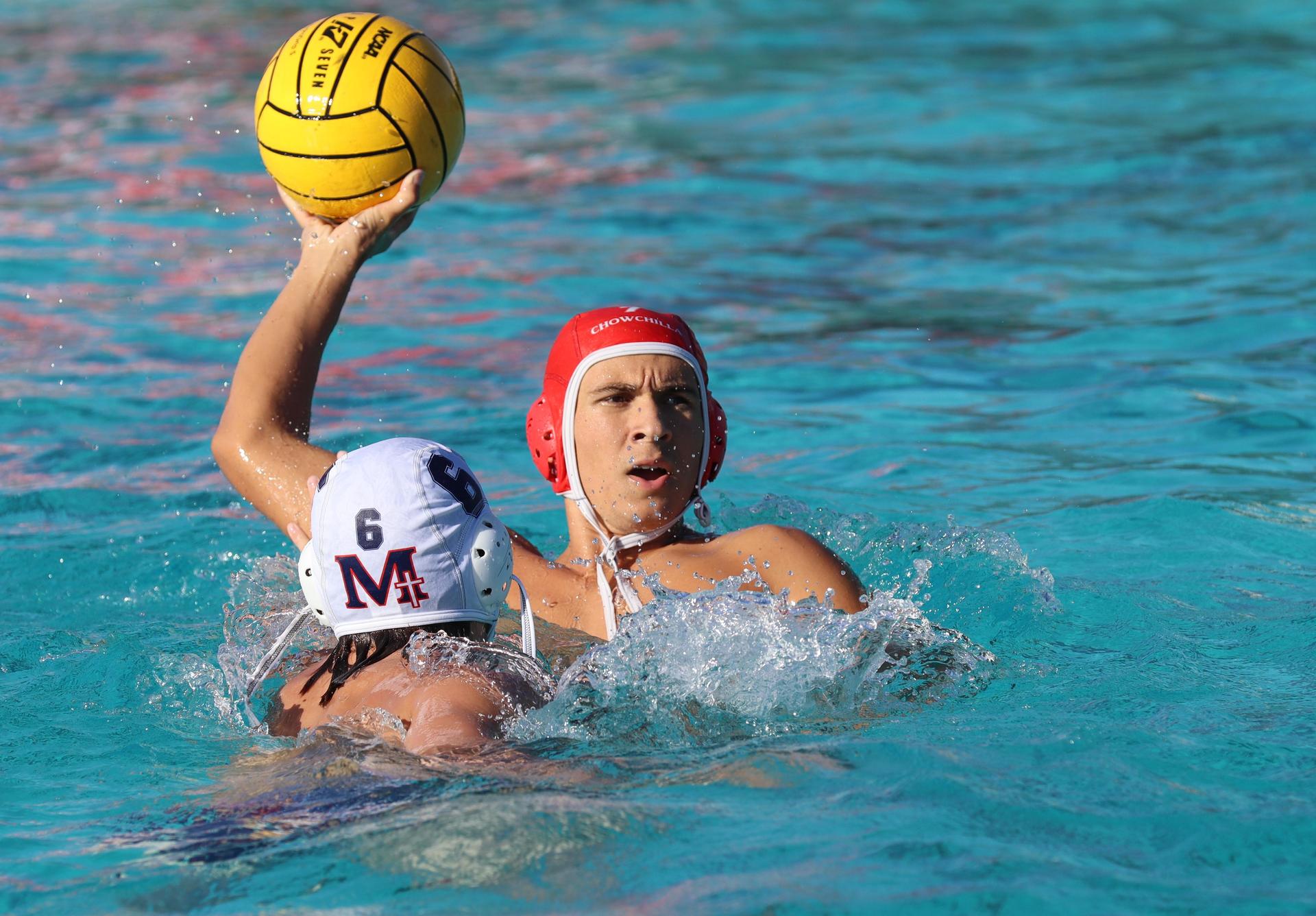 boys water polo players in action against san joaquin memorial