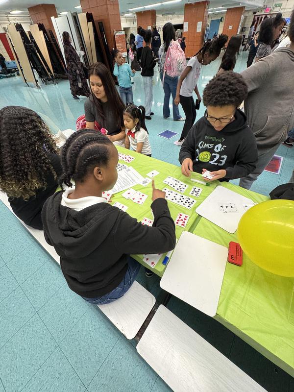 Students and families playing math game