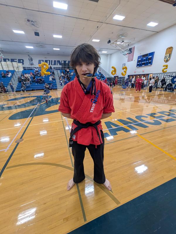 Student wins award at martial arts tournament.