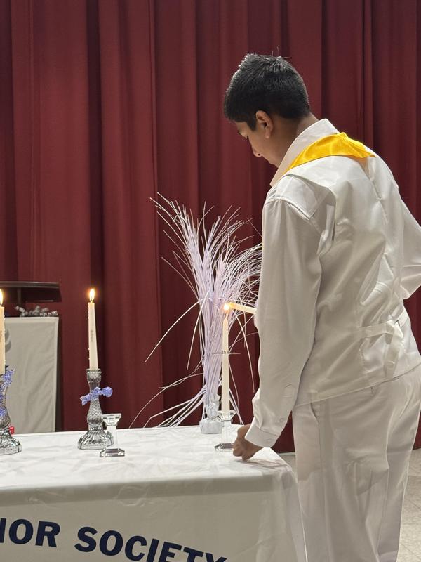 One of the pillars lighting the candles