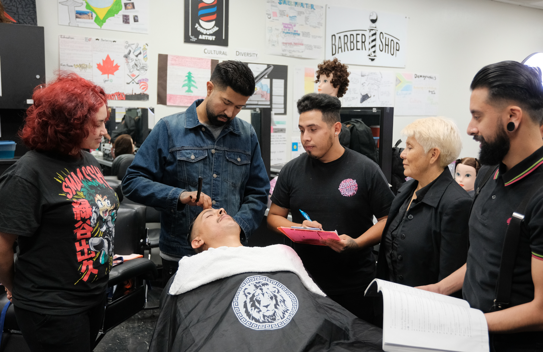 Shuffle banner for district homepage - infographic of students in Barber class for CTE education at the Village Suites