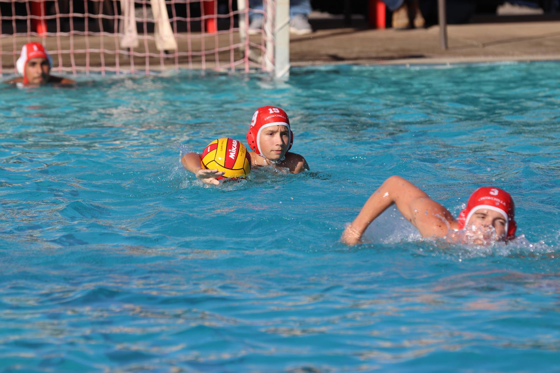 boys playing water polo against Madera