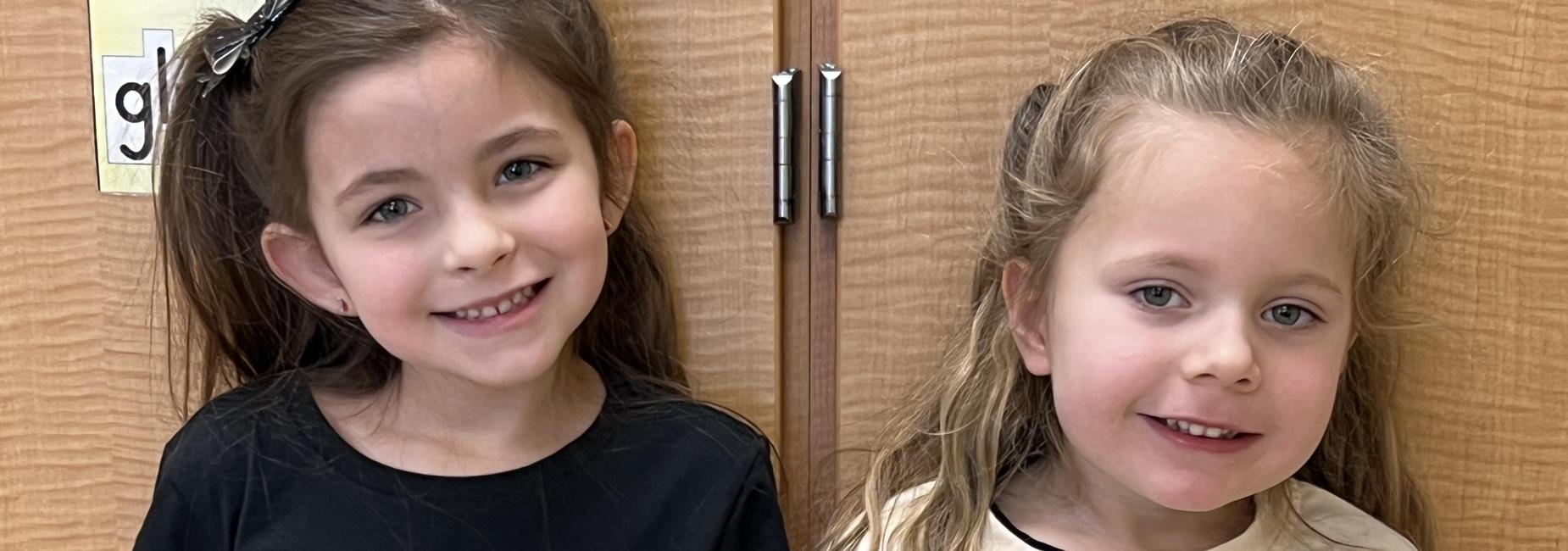Two students wear their 100 days of school shirts