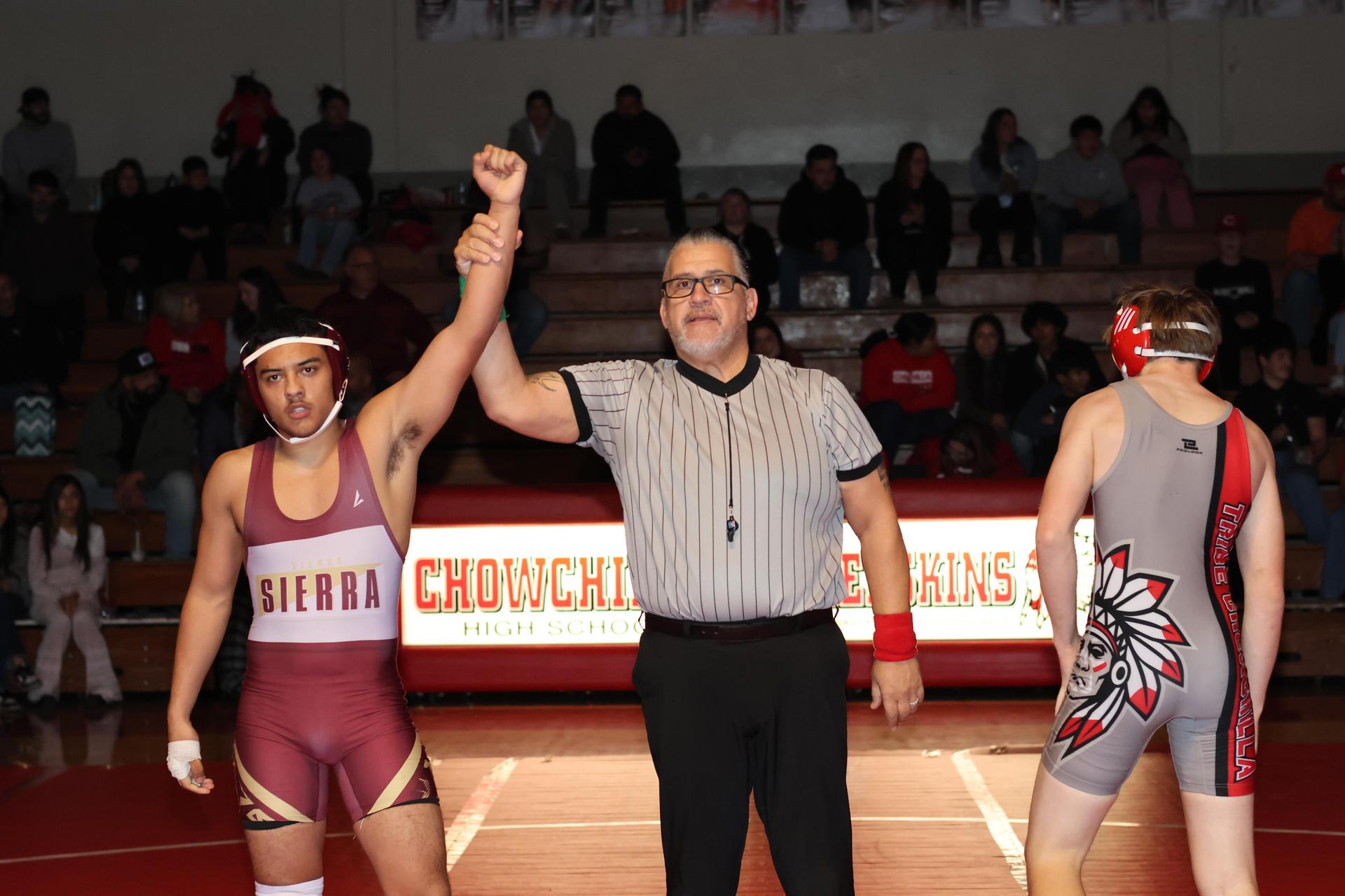 Wrestling winners with hands up 31