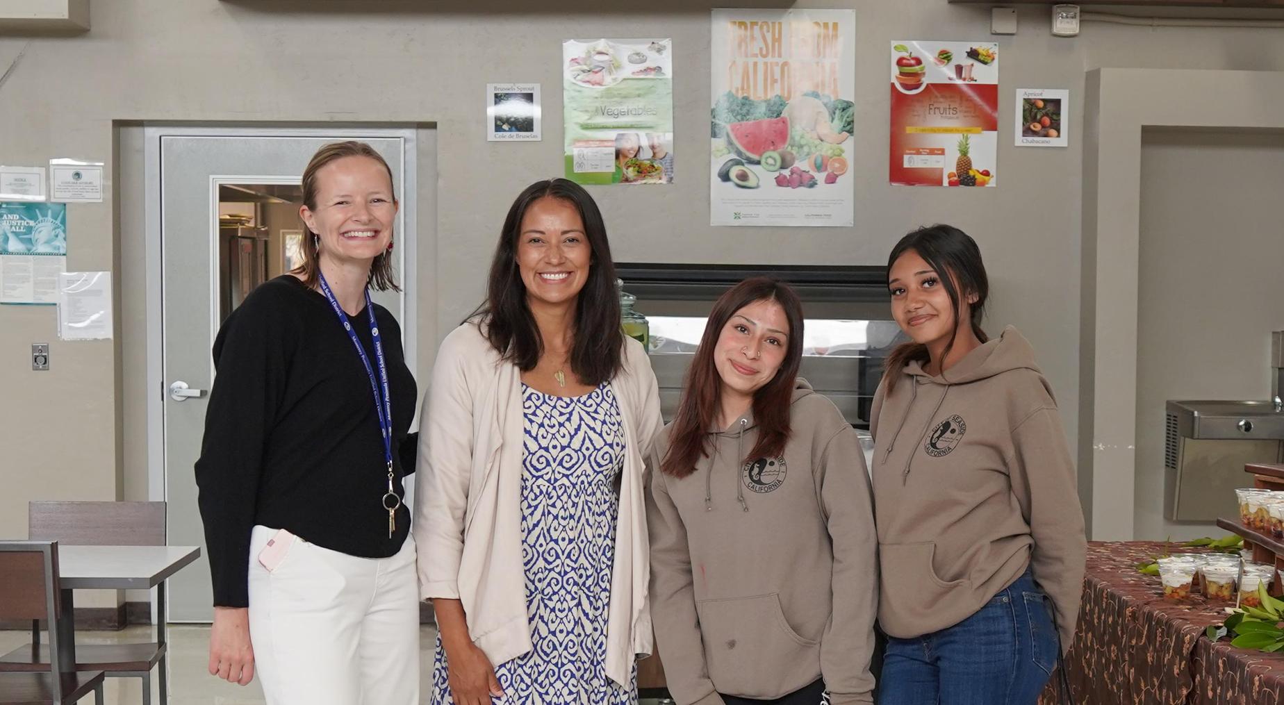 A female group of teacher and students