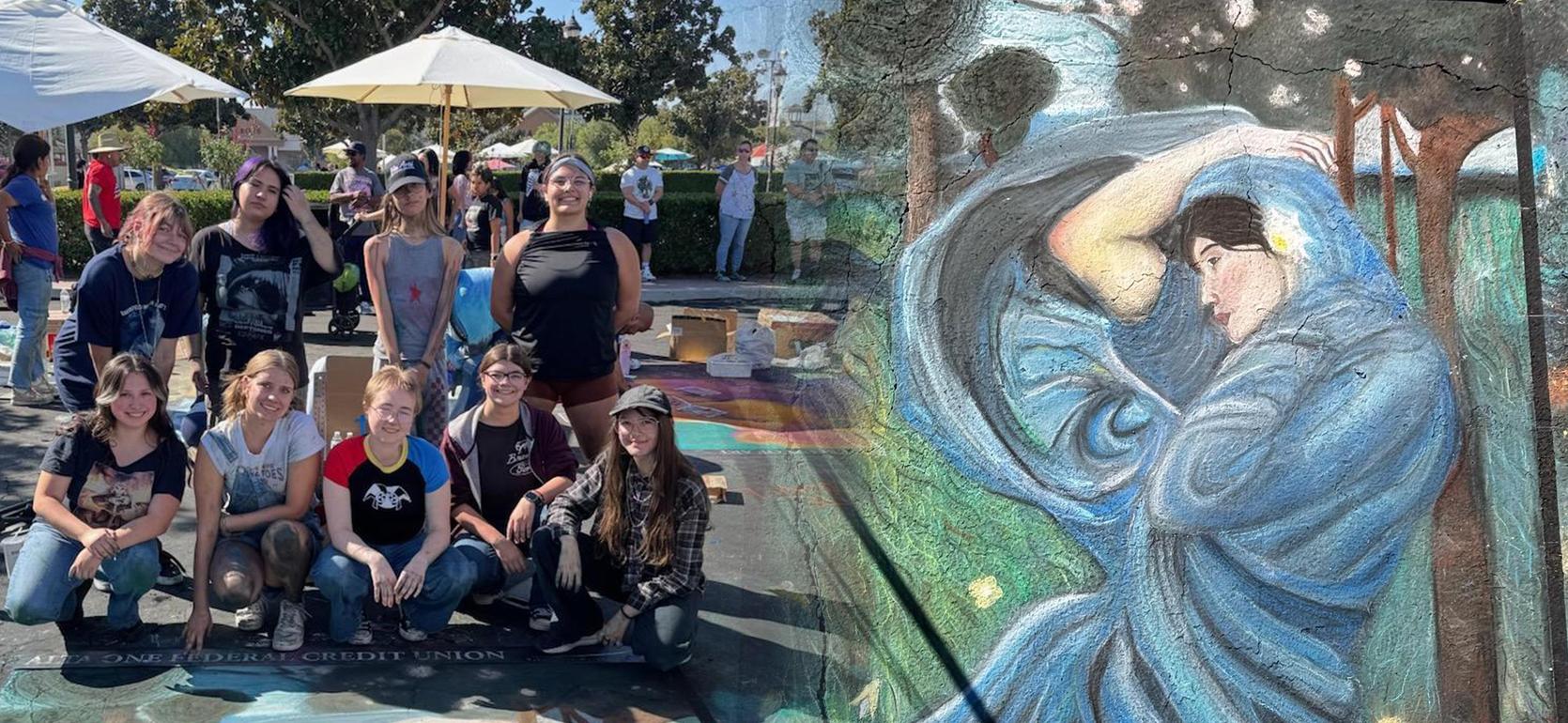 Group of artists posing at an outdoor art event alongside a vibrant chalk mural.