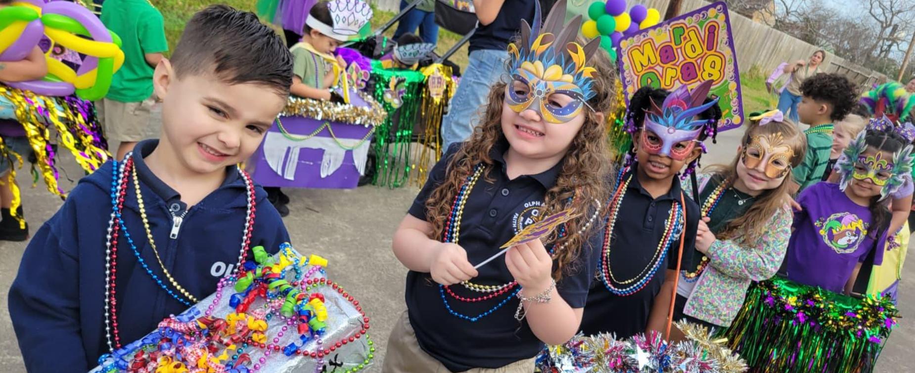 Children in costumes celebrate with beads and masks at a festive parade.