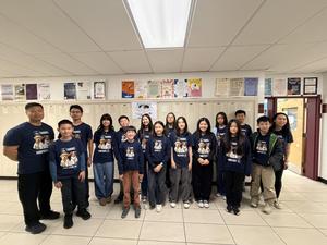 A group of students standing in a straight line for a picture