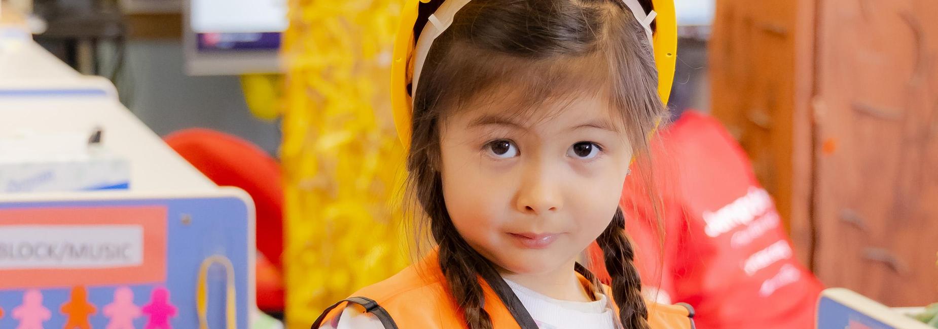 Child in construction outfit