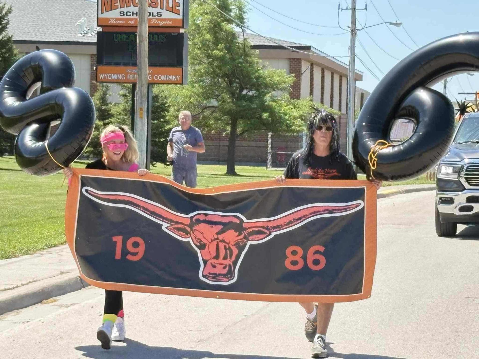 Bob wearing a wig and leading the parade.