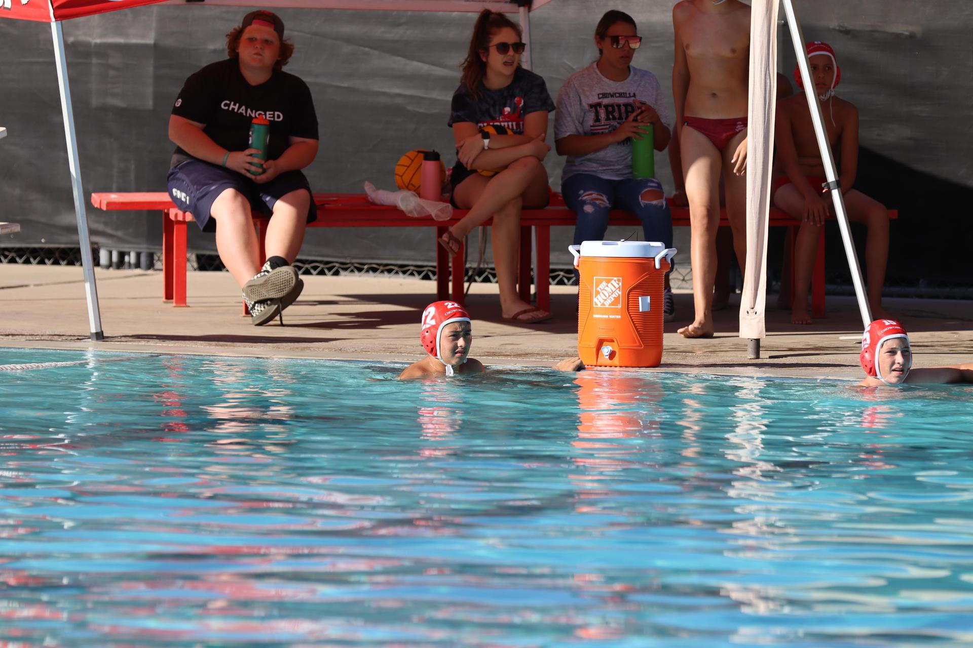 boys playing water polo against Madera