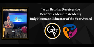 Image depicts Mr. Brindza in a gray suit while holding his award at the event. It also announces that he was recognized with the Judy Heumann Educator of the Year Award.