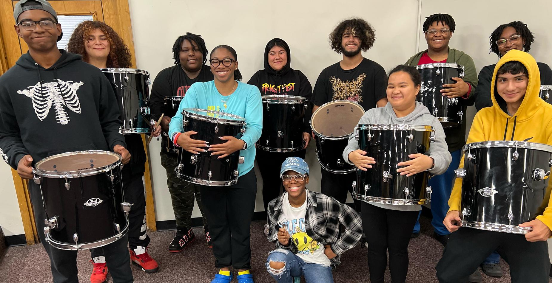 Dr. Justin Antos and the Eisenhower band program tuned and refurbished drums to give to the Drum Circle at the Adult Transition Program.
