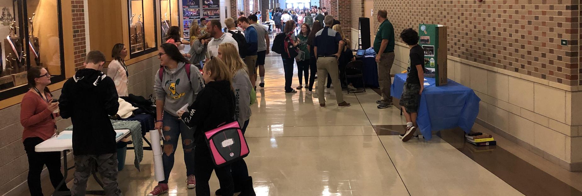 Packed hallways learning about clubs